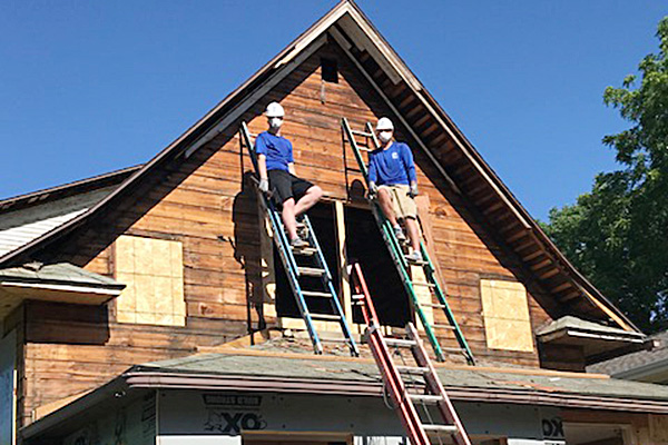 Two guys three ladders