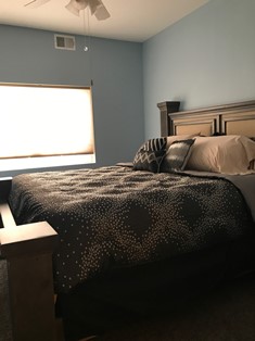 Bed next to large window