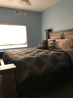 Bed next to large window