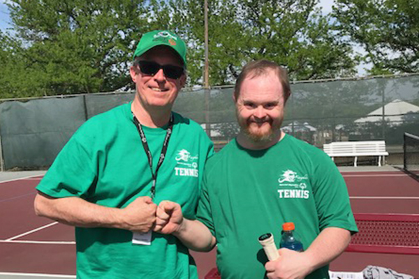 Just a couple of buds playing tennis