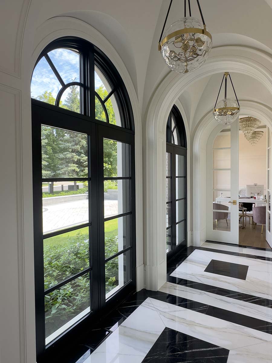 Bright open hallway with arched transoms