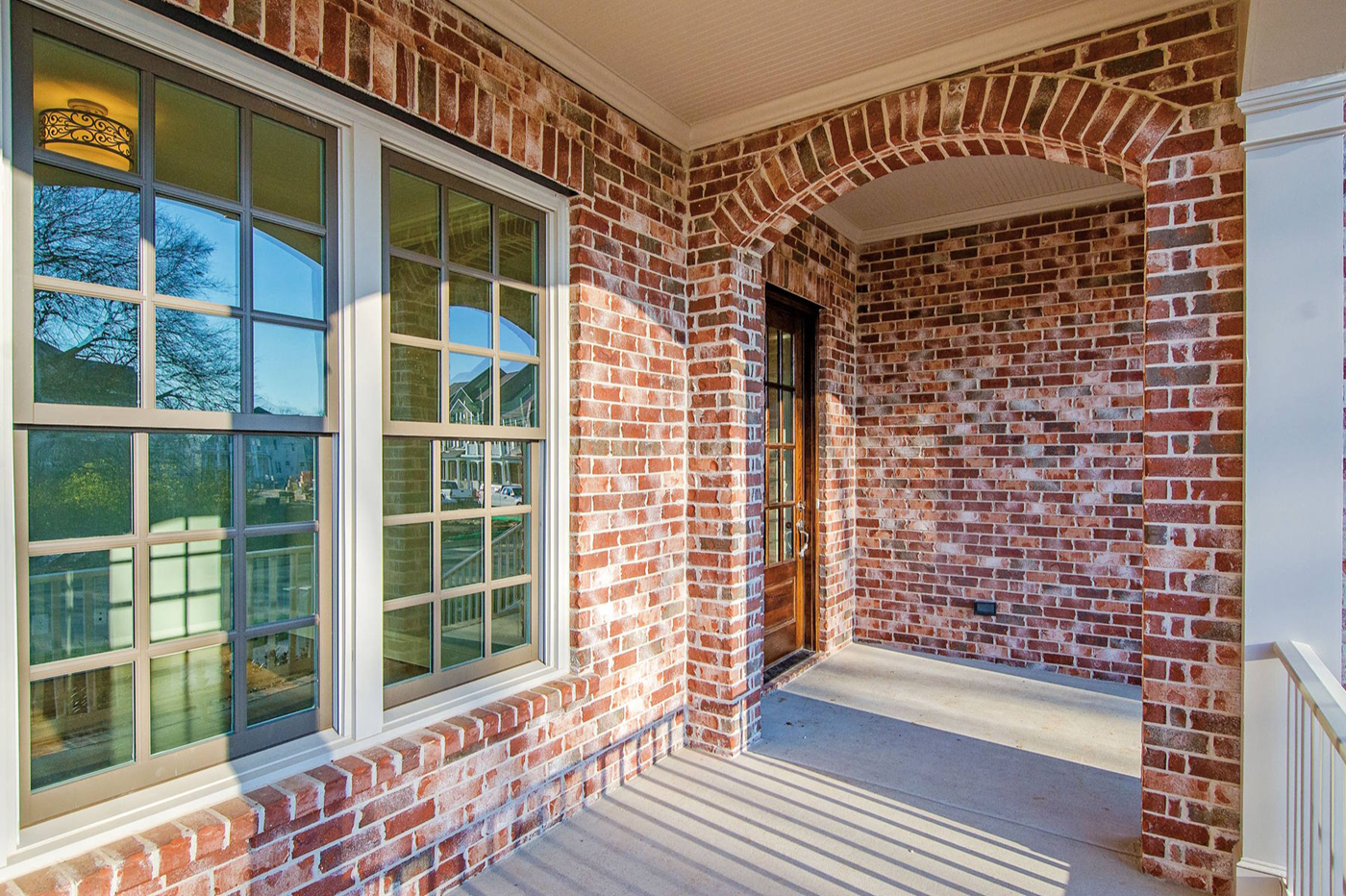 Exterior view of a legend window in a brick home