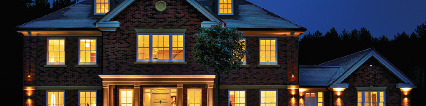 House at night with windows illuminated